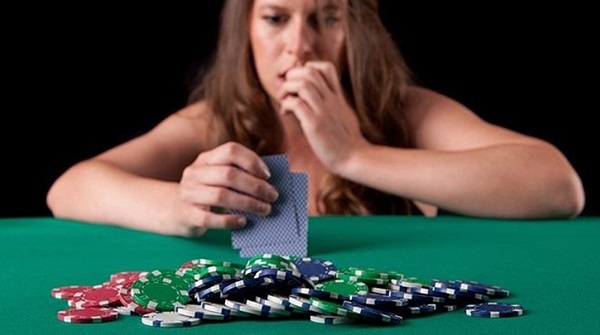 Woman Playing Poker Looking Nervous