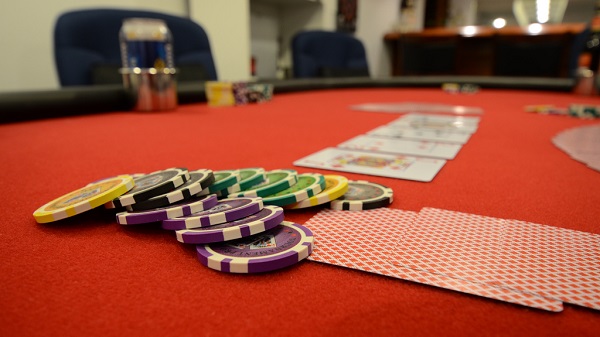 Poker Table With Chips and Cards