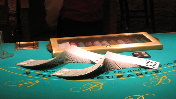 Two Decks of Cards Stacked On Blackjack Table