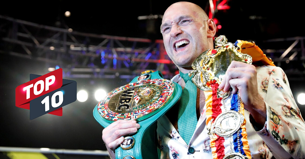 Boxer Tyson Fury Smiling and Holding His Heavyweight Belts - Top 10 Icon